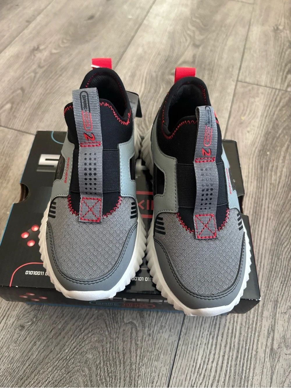 Skechers Kids Grey and Black Slip-On Sneakers with Red Highlights